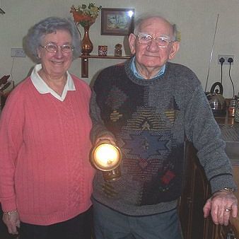 Joan & Les with lit lamp (and he still has his eyebrows!)
